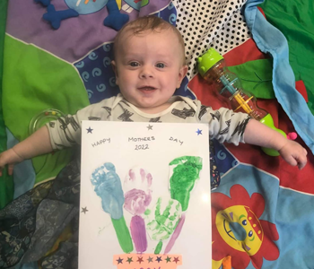 Child with a footprints painting