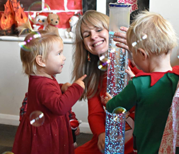 Children playing with toys and fake snow