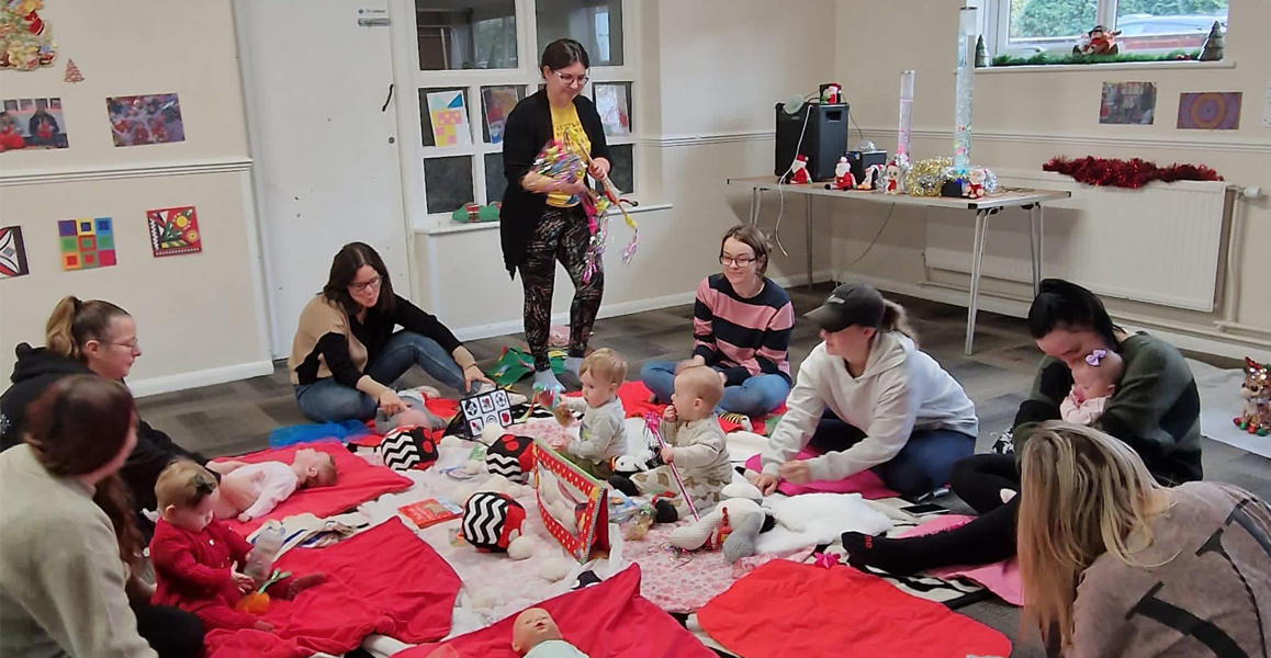 Parents and children play on play mats